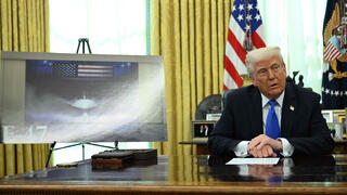 U.S. President Donald Trump with image of F-47 fighter jet