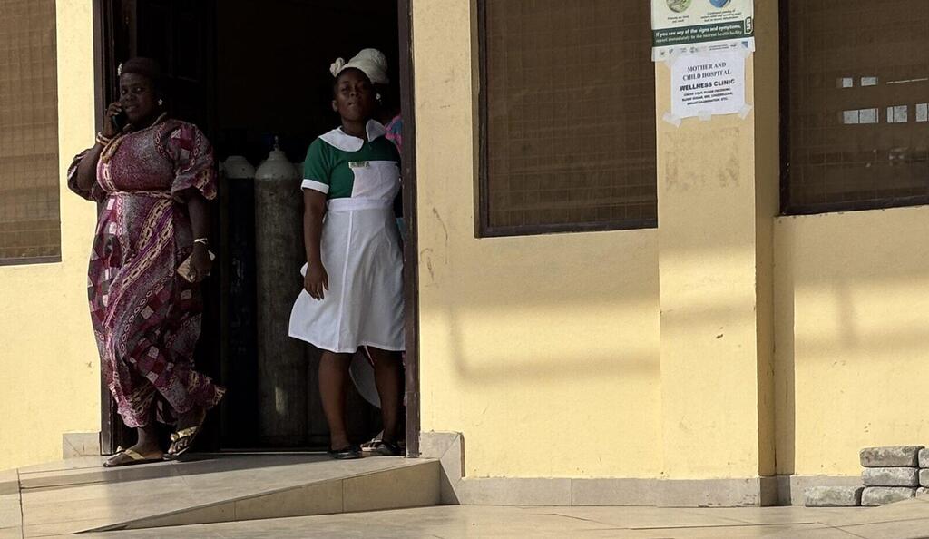 A nurse peeks through the door at Ghana’s Mother and Child Hospital (Photo: Maayan Hoffman/The Media Line) A nurse peeks through the door at Ghana’s Mother and Child Hospital