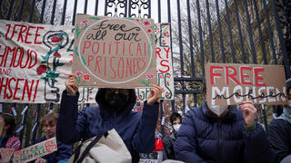 Students and others demonstrate during a protest outside the gates to the Columbia University on Monday 