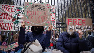 Students and others demonstrate during a protest outside the gates to the Columbia University on Monday 