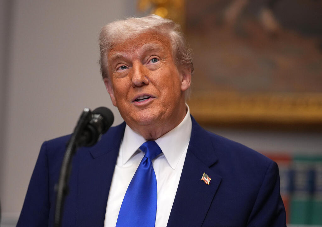 Donald Trump (Photo: Jim WATSON / AFP Andrew Harnik/Getty Images REUTERS/Nathan Howard) דונלד טראמפ מדבר בהצהרה שנתן על שחרורו של עידן אלכסנדר