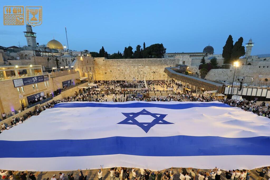 Giant Israeli flag measuring 46 meters by 28 meters was unfurled across the Western Wall Plaze    