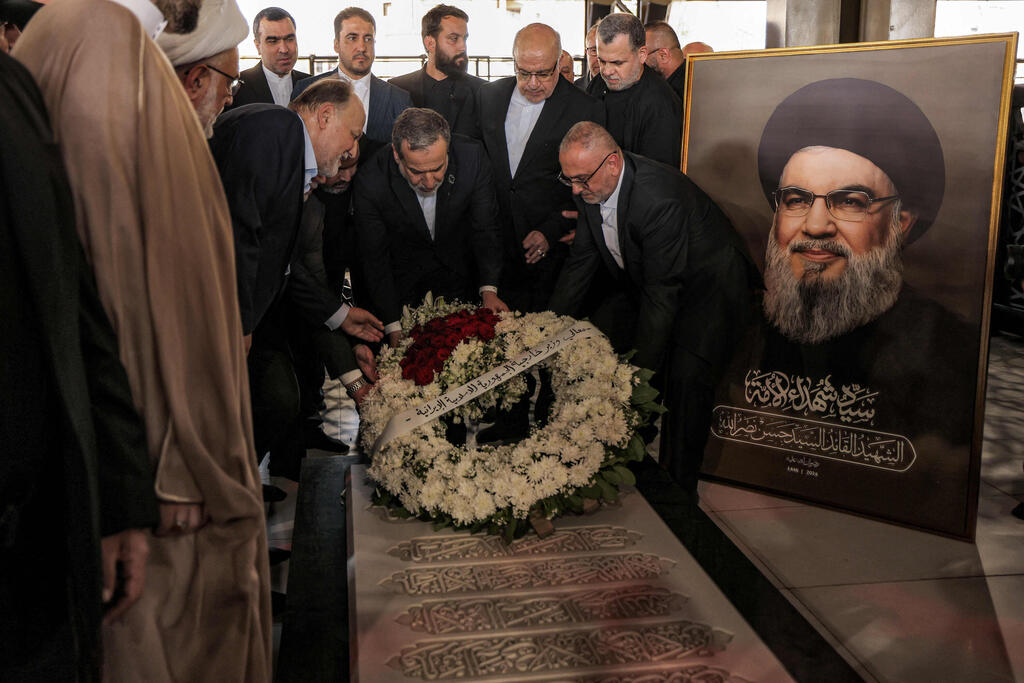 Iran's Foreign Minister Abbas Araghchi lays a wreath of flowers at the grave of slain Hezbollah's Leader Hassan Nasrallah 