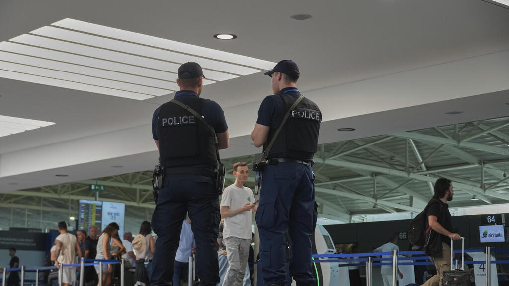 Armed Cypriot police patrol the public areas of the departure lounge of Cyprus' main Larnaca airport (Photo: Petros Karadjias / AP) Armed Cypriot police patrol the public areas of the departure lounge of Cyprus' main Larnaca airport