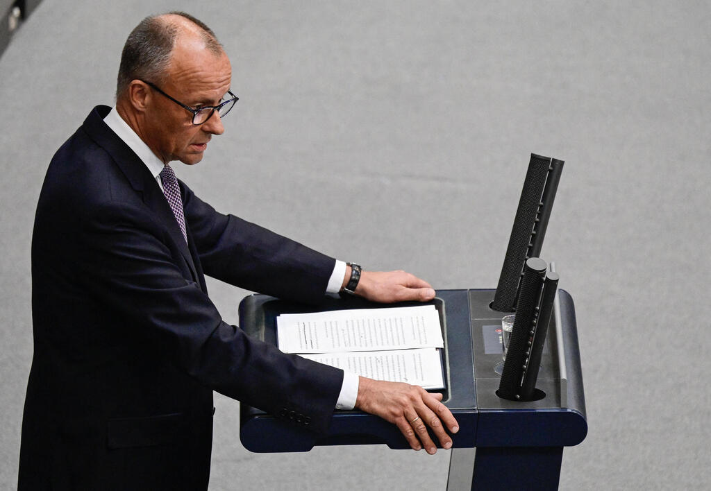 German Chancellor Friedrich Merz addresses delegates at the Bundestag (lower house of parliament) on June 24, 2025 in Berlin, prior on the upcoming NATO and EU summits.