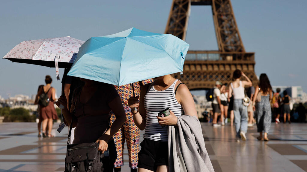Heat wave in Paris (Photo: Ludovic Marin / AFP) גל חום בפריז