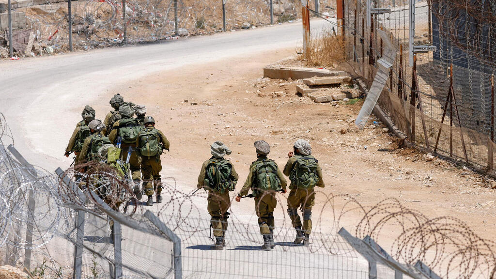 IDF troops on the Syrian border (Photo: Jalaa Marey / AFP) כוחות צה"ל בגבול סוריה