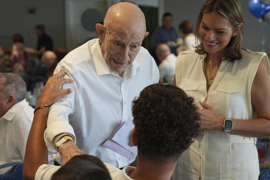 Harold Terens,  a World War II veteran who fought in D-Day, greets friends at his 102 birthday party Saturday, July 26, 2025, in Delray Beach, Fla. 