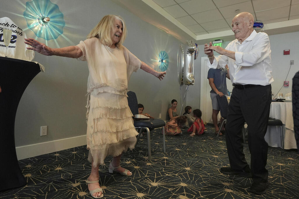 Jeanne Swerlin dances with her husband Harold Terens,  a World War II veteran who fought in D-Day, during his 102 birthday party Saturday, July 26, 2025, in Delray Beach, Fla. 