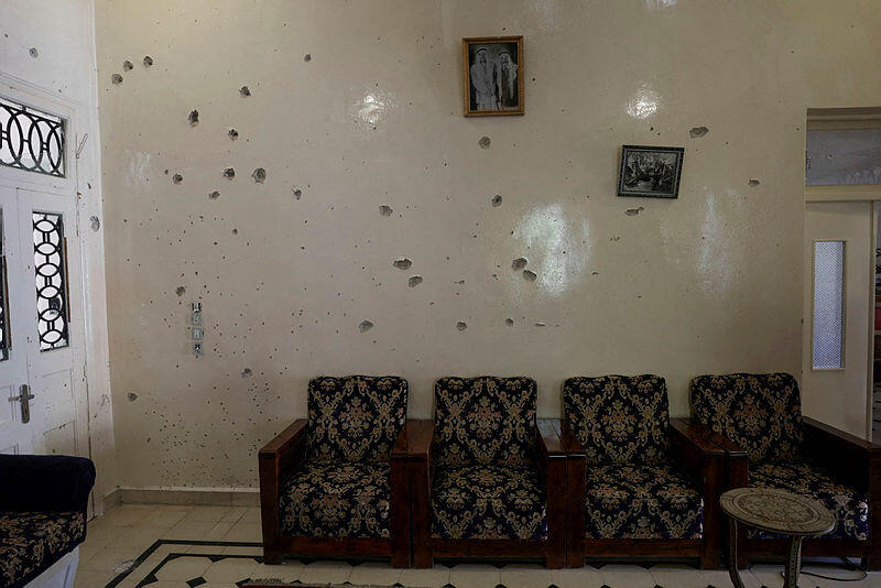 A wall is pockmarked by bullet holes inside the Saraya family house, following sectarian violence in Syria's Sweida province, where government forces were sent to quell local clashes between Druze armed factions and Bedouin tribal fighters, in the predominantly Druze city of Sweida, Syria, July 25, 2025