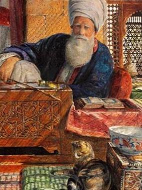 חתול נח על כרית ליד אימאם בקהיר