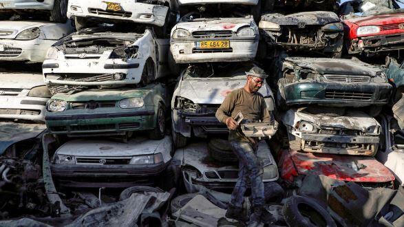 Crushed stolen cars in the West Bank