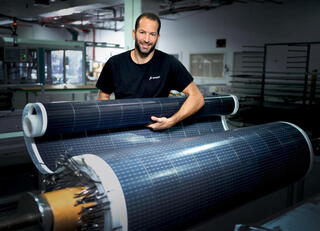 Oded Rosenberg, CEO of Apollo Power, with one of the company’s solar sheets 