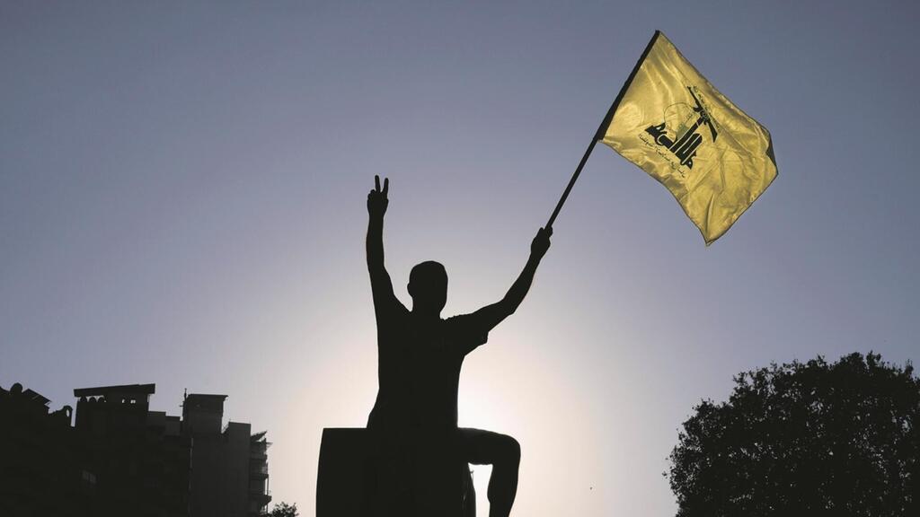Waving hte Hezbollah flag in southern Lebanon (Photo: Bilal Hussein/AP) Waving hte Hezbollah flag in southern Lebanon