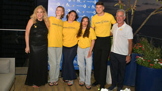 Make-a-Wish Israel co-founder Denise Bar-Aharon (left) and Sylvan Adams (right) with service recipients
