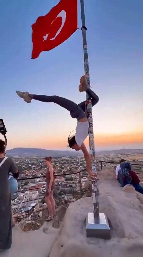 Woman dances on Turkish flagpole 