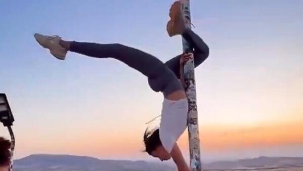 Woman dances on Turkish flagpole 