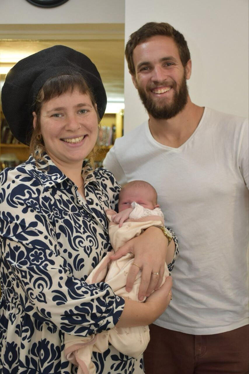 Odeya with her late husband Maoz, z”l and daughter Teneh. Teneh was only three and a half months old when he was killed (Photo: Courtesy of the family) אודיה עטייה־פניגשטיין לצד מעוז פניגשטיין. טנא הייתה בת שלושה חודשים וחצי כשהוא נהרג