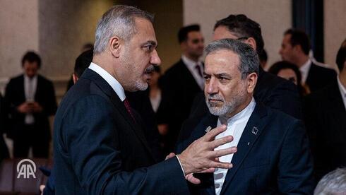 האקאן פידאן ועבאס עראקצ'י בפגישה בדוחא