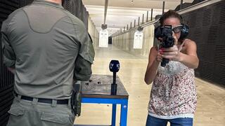 Executive Editor Maayan Hoffman holds a rifle with the Arbel technology