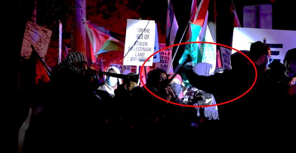 Dr. Moshe Glick grabs and swats away Altaf Sharif’s vuvuzela 