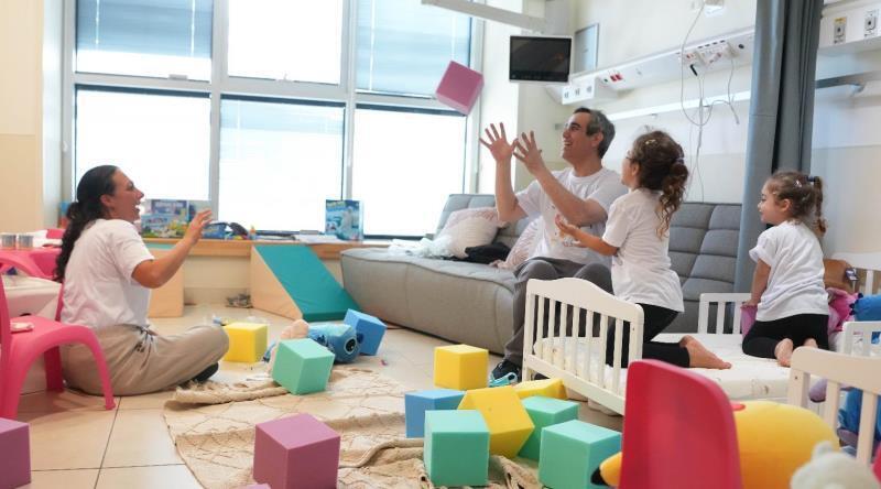 Omri Miran with his wife and daughters 