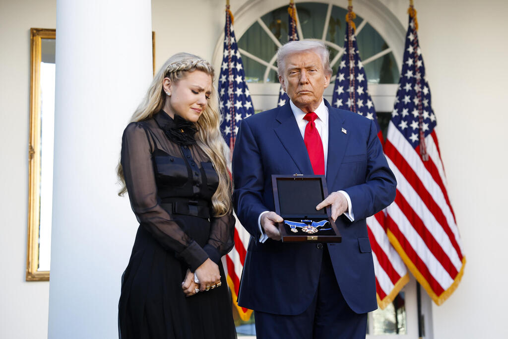 U.S. President Donald Trump posthumously awards the Presidential Medal of Freedom to late conservative activist Charlie Kirk as he presents the Medal to his wife Erika Kirk during a ceremony in the Rose Garden of the White House