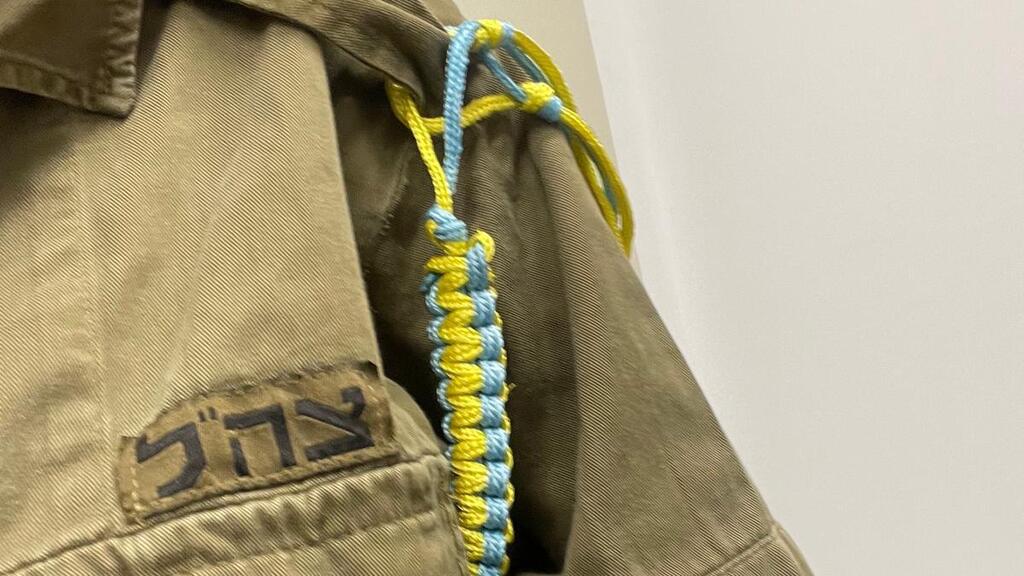 Noa Shuker in her army uniform. The blue and yellow string is the symbol of all casualty officers in the IDF.