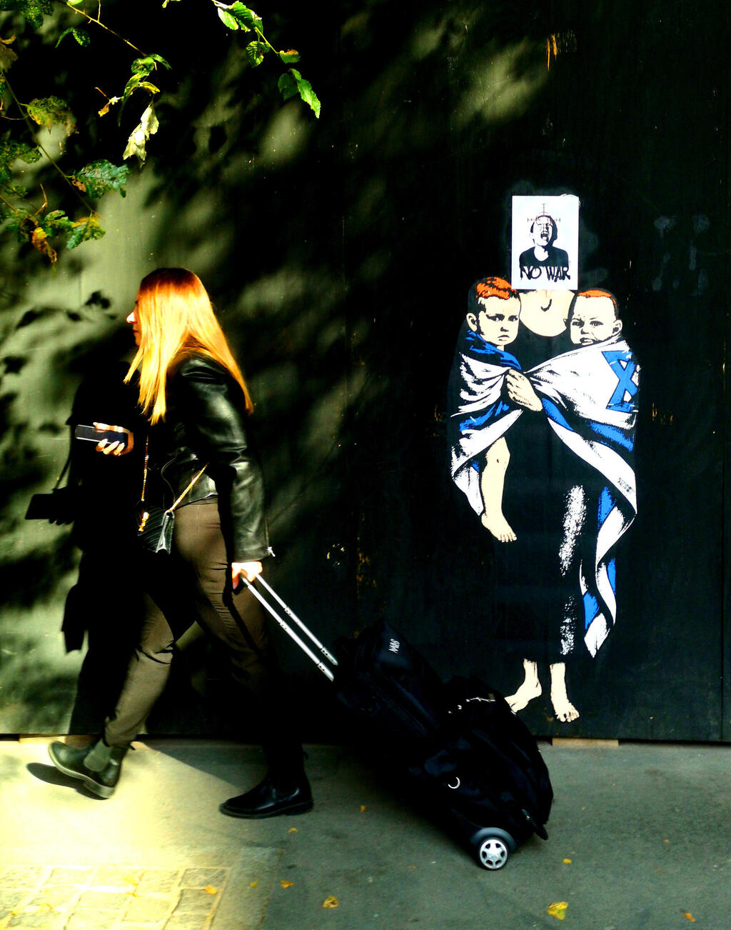 Vandalized mural of the Bibas family dedicated to the victims of October 7