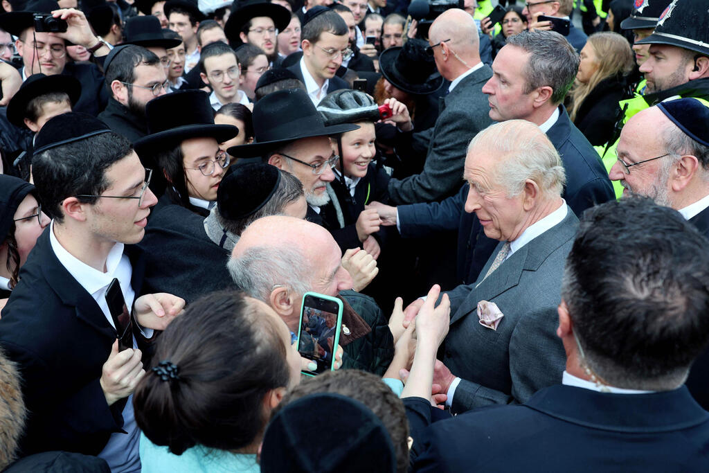 King Charles III meets members of the community during a visit to Heaton Park Hebrew Congregation Synagogue on October 20, 2025 in Manchester, England