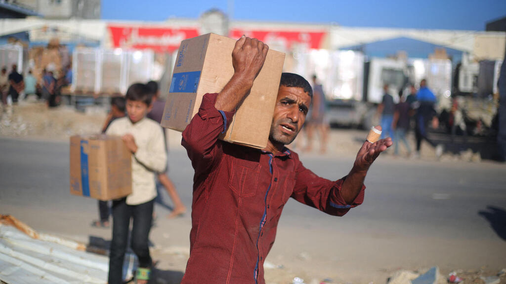 Photo: Eyad Baba/ AFP סיוע הומניטרי בעזה