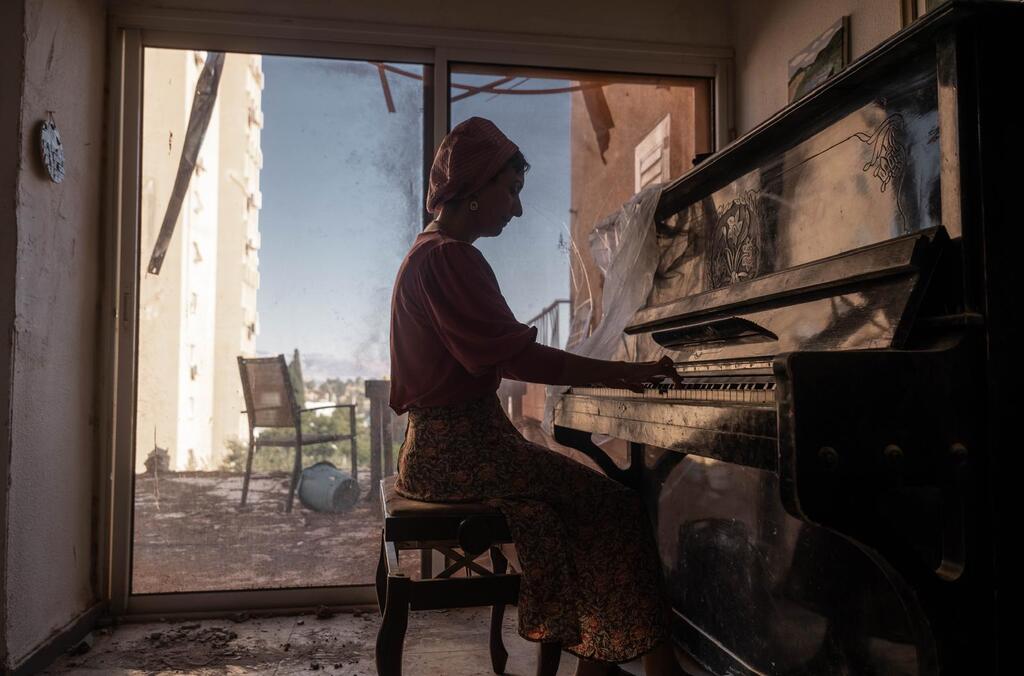 Woman plays piano in a kibbutz after the Oct 7 massacre 