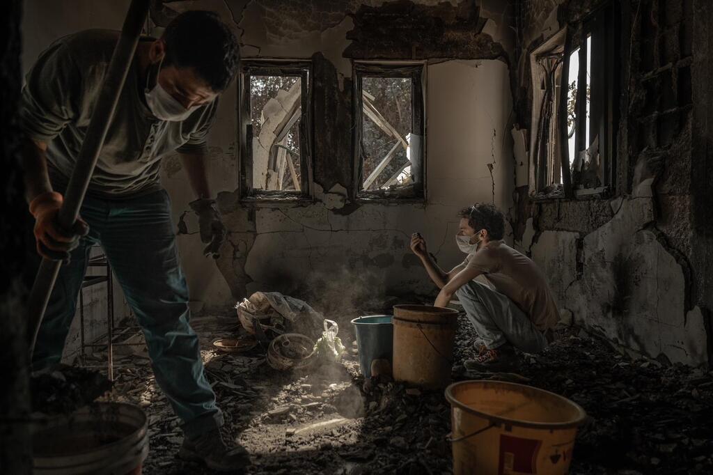 Workers search for remains following the October 7 attack 