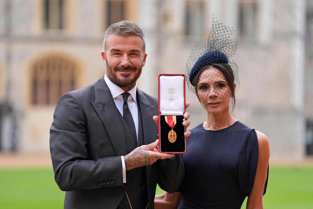 Sir David Beckham and Victoria Beckham (Photo: Andrew Matthews / POOL / AFP) סר דייויד בקהאם וויקטוריה בקהאם