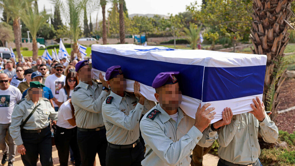 Photo: Menahem Kahana / AFP הלווייתו של אל"מ אסף חממי ז"ל