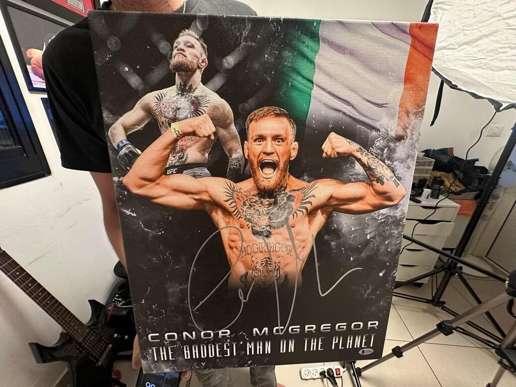A signed poster of UFC star Conor McGregor, titled 'The Baddest Man on the Planet' (Photo: Bar Gindy) A signed poster of UFC star Conor McGregor, titled 'The Baddest Man on the Planet'