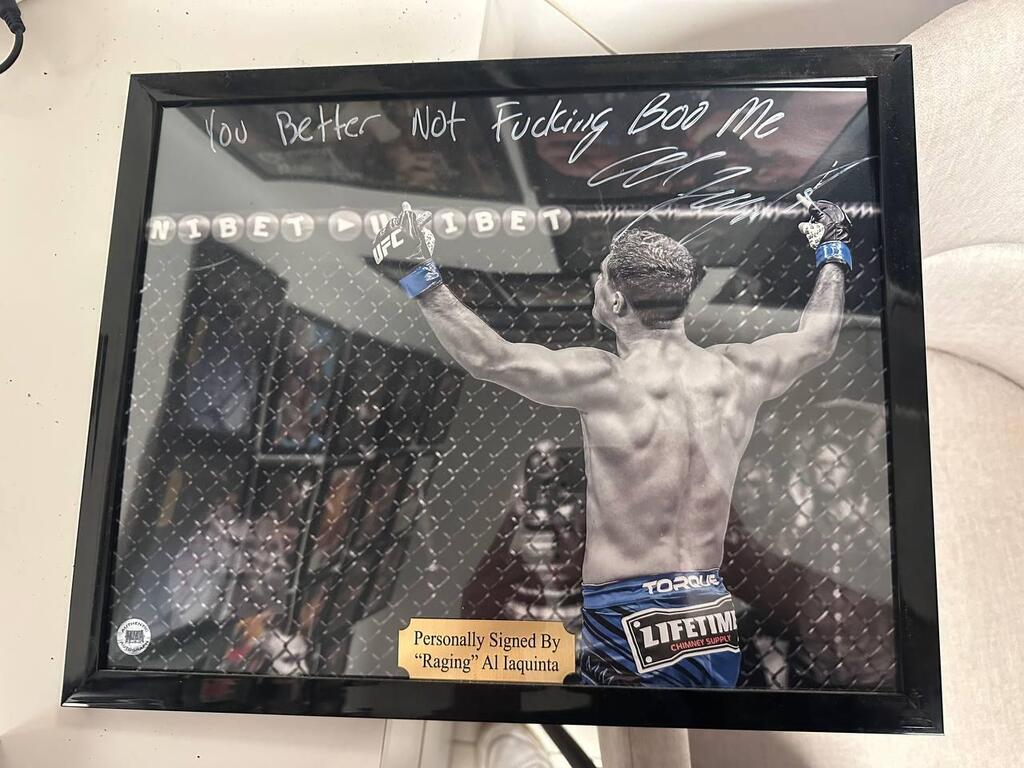 A signed photograph of UFC fighter Al Iaquinta bearing the message 'You better not f***ing boo me' (Photo: Bar Gindy) A signed photograph of UFC fighter Al Iaquinta bearing the message 'You better not f***ing boo me'