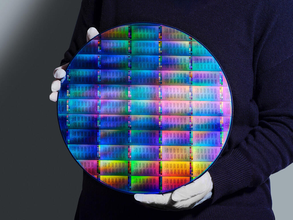 IBM researcher holding 300mm IBM Quantum Nighthawk wafer (Photo: IBM) IBM researcher holding 300mm IBM Quantum Nighthawk wafer