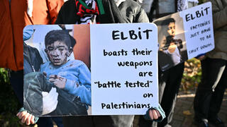 Department of Justice logo is seen on a podium during a press conference at the U.S. Attorney's Office in New York