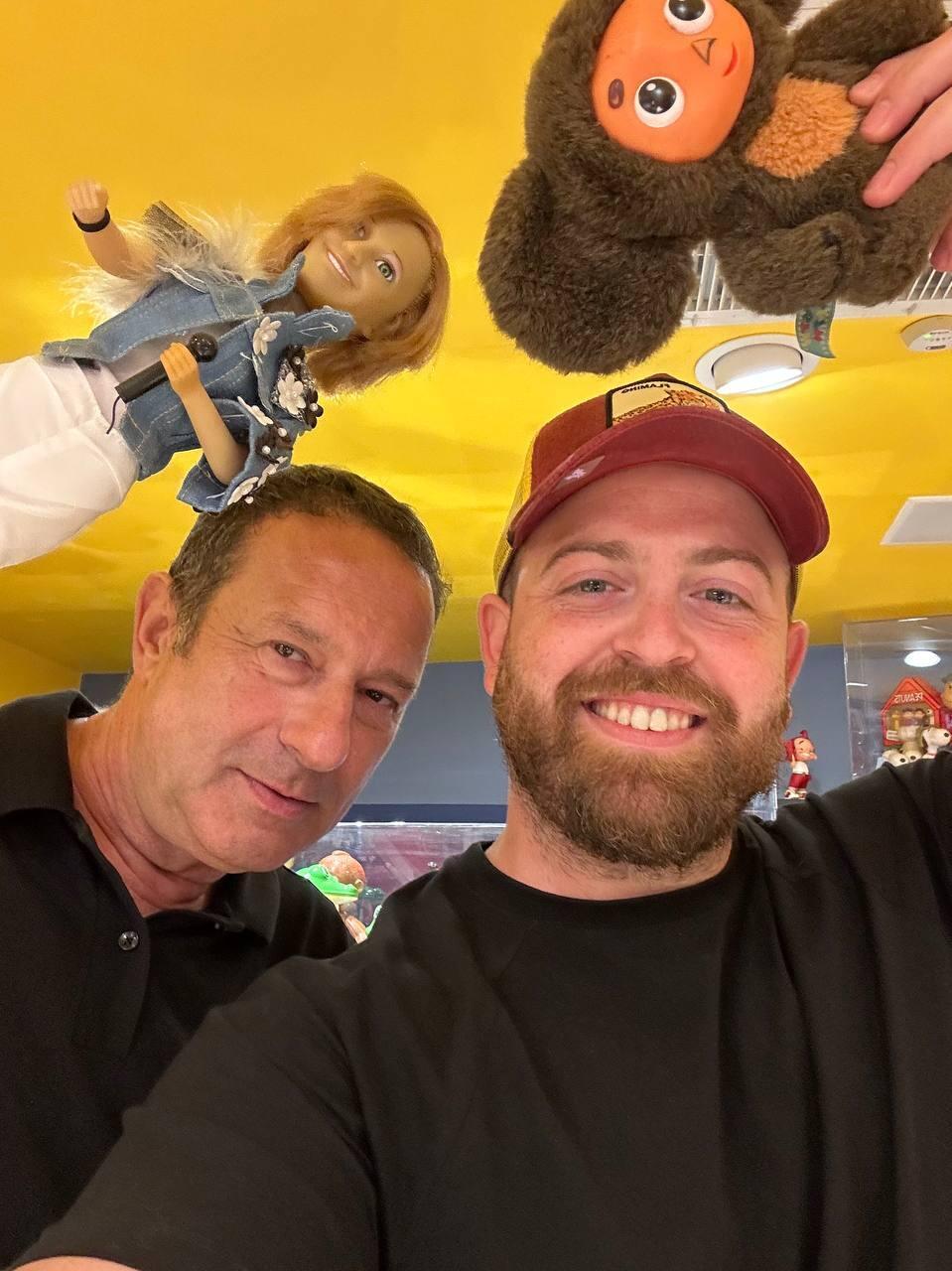 Fashion designer and collector Yaron Minkowski, left, and People & Collectors host Bar Gindy pose inside Minkowski’s Toy & Nostalgia Museum in Jaffa 
