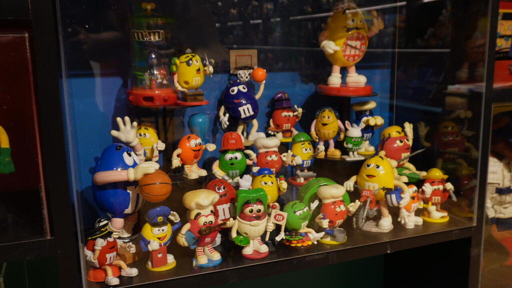 M&M character figurines fill a display case at Yaron Minkowski’s Toy & Nostalgia Museum in Jaffa, July 9, 2025 