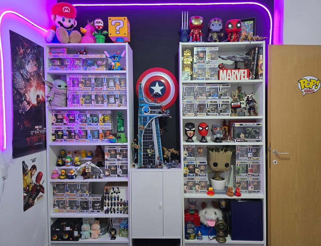 Shelves of LEGO sets, Funko Pops and collectibles line Lin Cohen’s apartment 