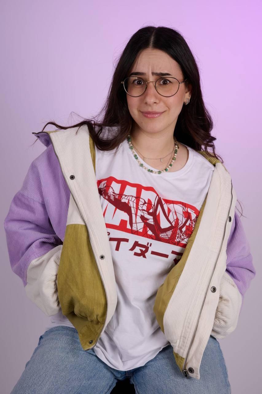 Lin Cohen, 25, a collector and custom toy artist, poses in a Marvel shirt. She is a rising figure in Israel’s geek and collecting scene 