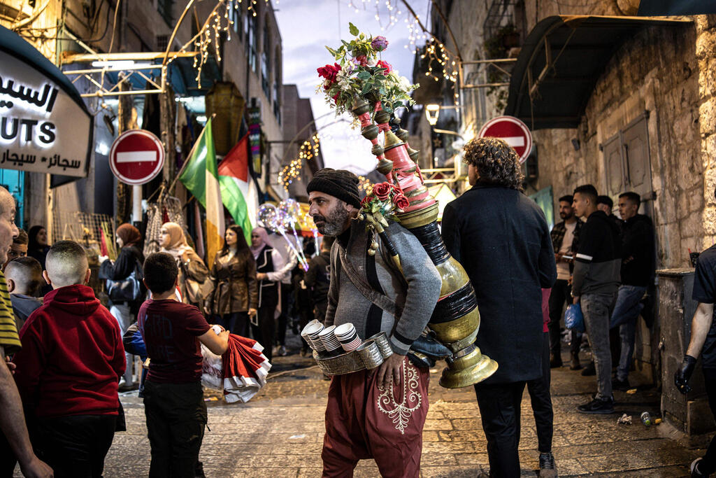 A man sells coffee in Nativity Square during a Christmas tree lighting ceremony in Bethlehem, West Bank, on December 6, 2025 (Photo: JOHN WESSELS / AFP) A man sells coffee in Nativity Square during a Christmas tree lighting ceremony in Bethlehem, West Bank, on December 6, 2025