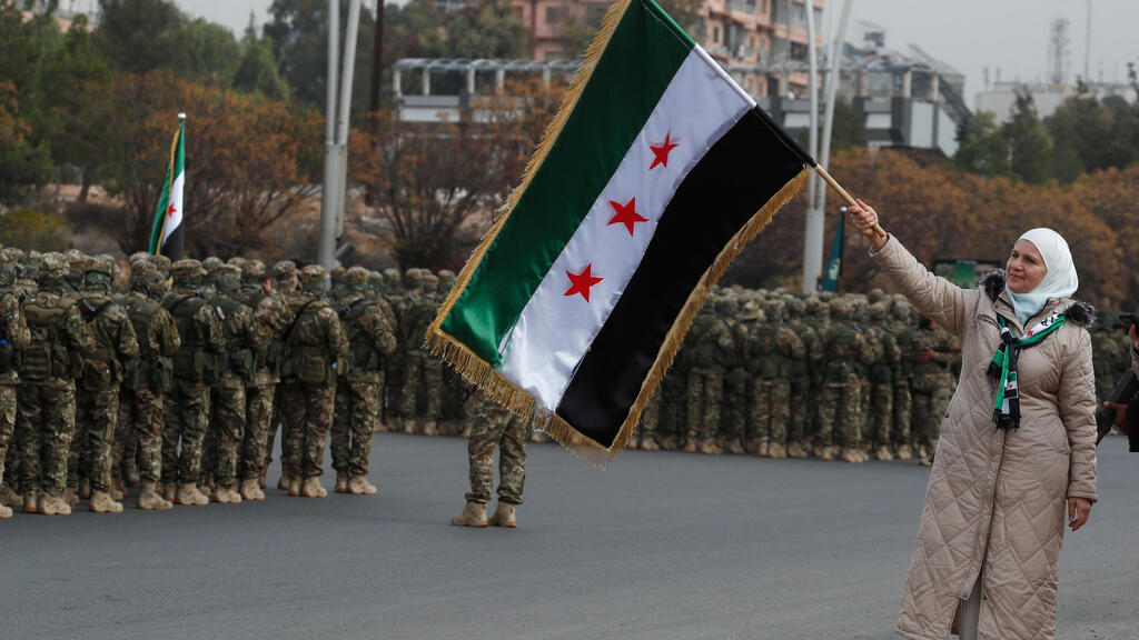 Syria celebrates a year to Bashar al-Assad's fall
(Photo: Omar Sanadiki/ AP) סוריה חגיגות שנה ל הפיכה ולהפלת משטר אסד דמשק