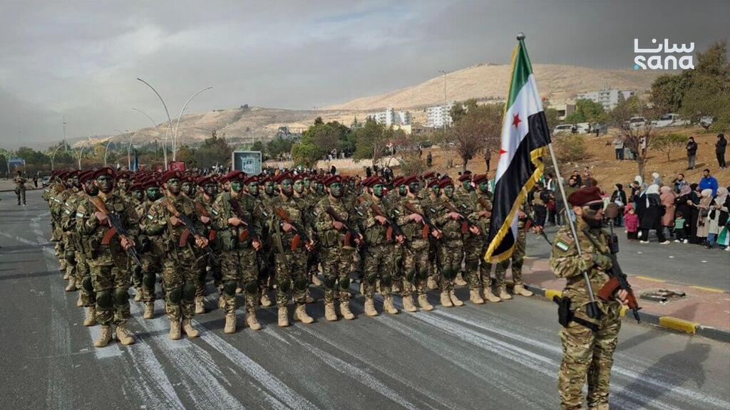 Military parade held this morning to mark 'Liberation Day' on December 8 (Photo: SANA) סוריה חגיגות שנה ל הפיכה ולהפלת משטר אסד דמשק