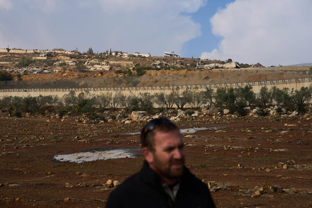 Levav Weinberg, farmer, stands in his orchard in Israel's northernmost town of Metula, on the Lebanon border, Sunday, Nov. 30, 2025 (Photo: AP Photo/Ariel Schalit) Levav Weinberg, farmer, stands in his orchard in Israel's northernmost town of Metula, on the Lebanon border, Sunday, Nov. 30, 2025