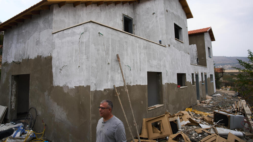 Avi Nadiv next to a home that's under renovation in Metula, Nov. 2025 (Photo: AP Photo/Ariel Schalit) Avi Nadiv, deputy mayor, next to a home that's under renovation in Israel's northernmost town of Metula, pressed up against the Lebanon border, Sunday, Nov. 30, 2025