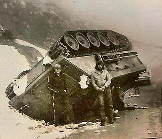 Ehud in front of the halftrack that overturned on the way to summit אהוד לפני הזחל"ם שהתהפך בדרך לכתר החרמון