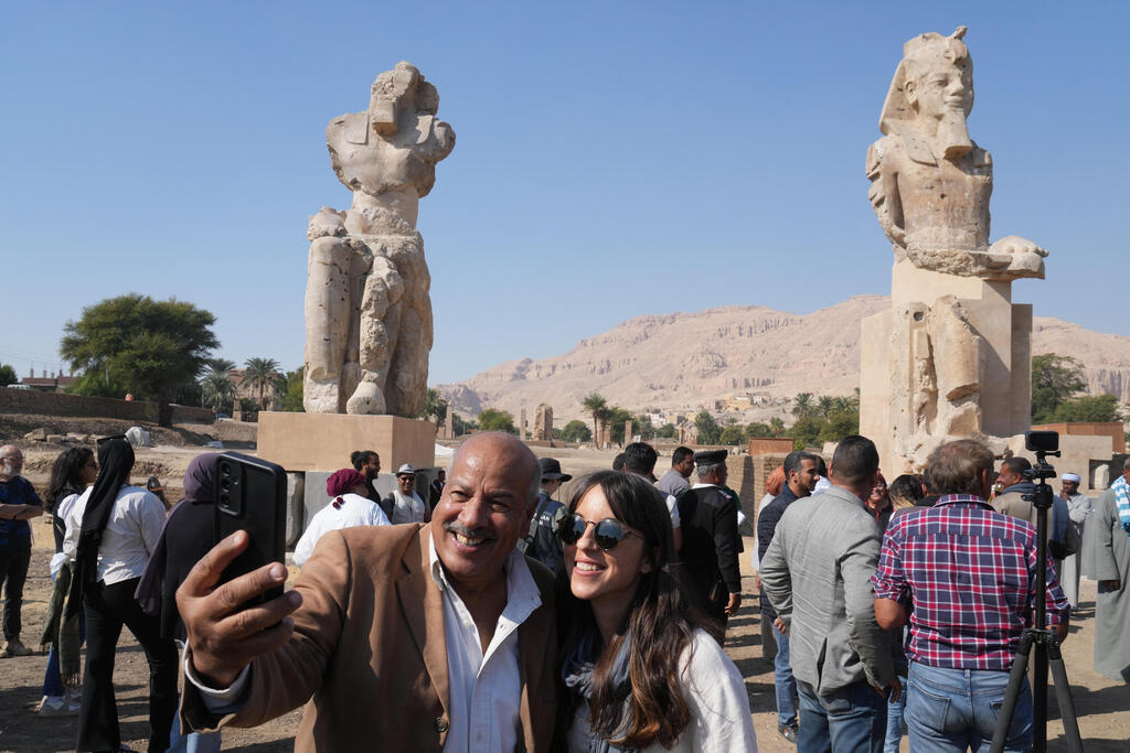 Visitors take photos with the two giant reassembled alabaster statues of Pharoah Amenhotep III, in the southern city of Luxor, Egypt, Sunday, Dec. 14, 2025 (Photo: AP Photo/Amr Nabil) Visitors take photos with the two giant reassembled alabaster statues of Pharoah Amenhotep III, in the southern city of Luxor, Egypt, Sunday, Dec. 14, 2025